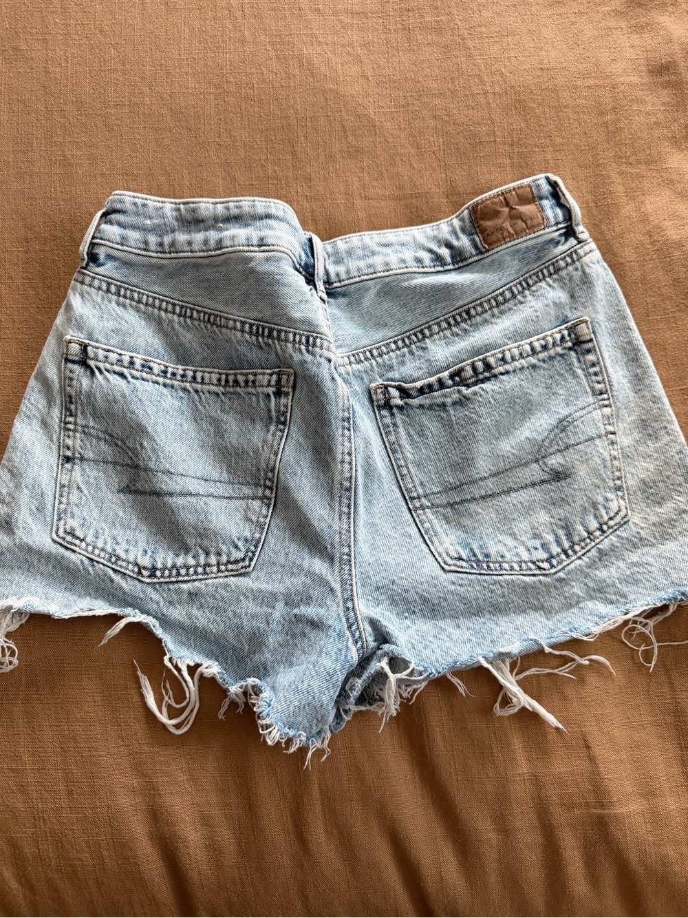 American Eagle Outfitters “Tomgirl” Light Blue Distressed Denim Cutoff Shorts